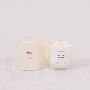 Candle and packaging with 'Desert Agave' label on a light gray background