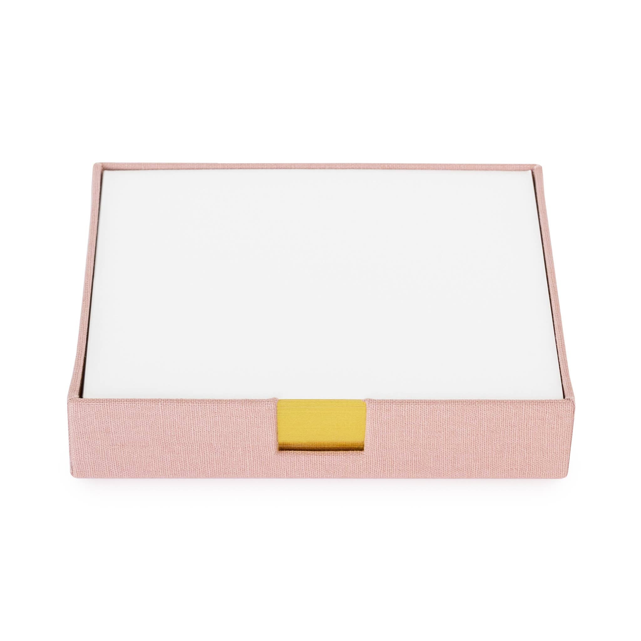 A pink canvas desk jotter with a gold foil label sits on a white background.