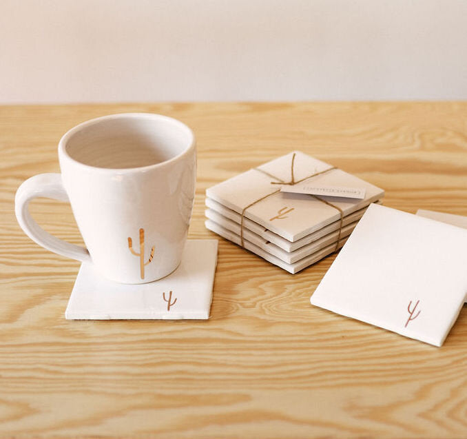 white coasters with gold cactus