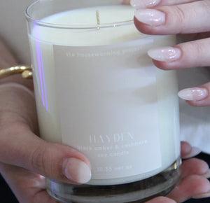 hands holding hayden candle
