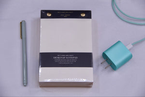 Green pen , notepad, mint charger