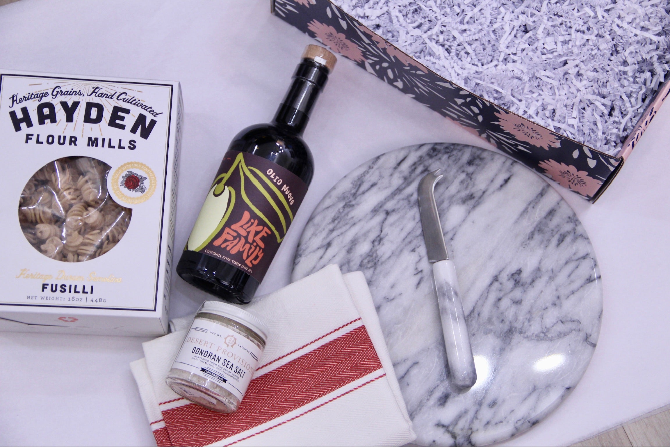 hayden pasta, olive oil bottle, sonoran sea salt, hand towel, marble cheese tray and knife, box 