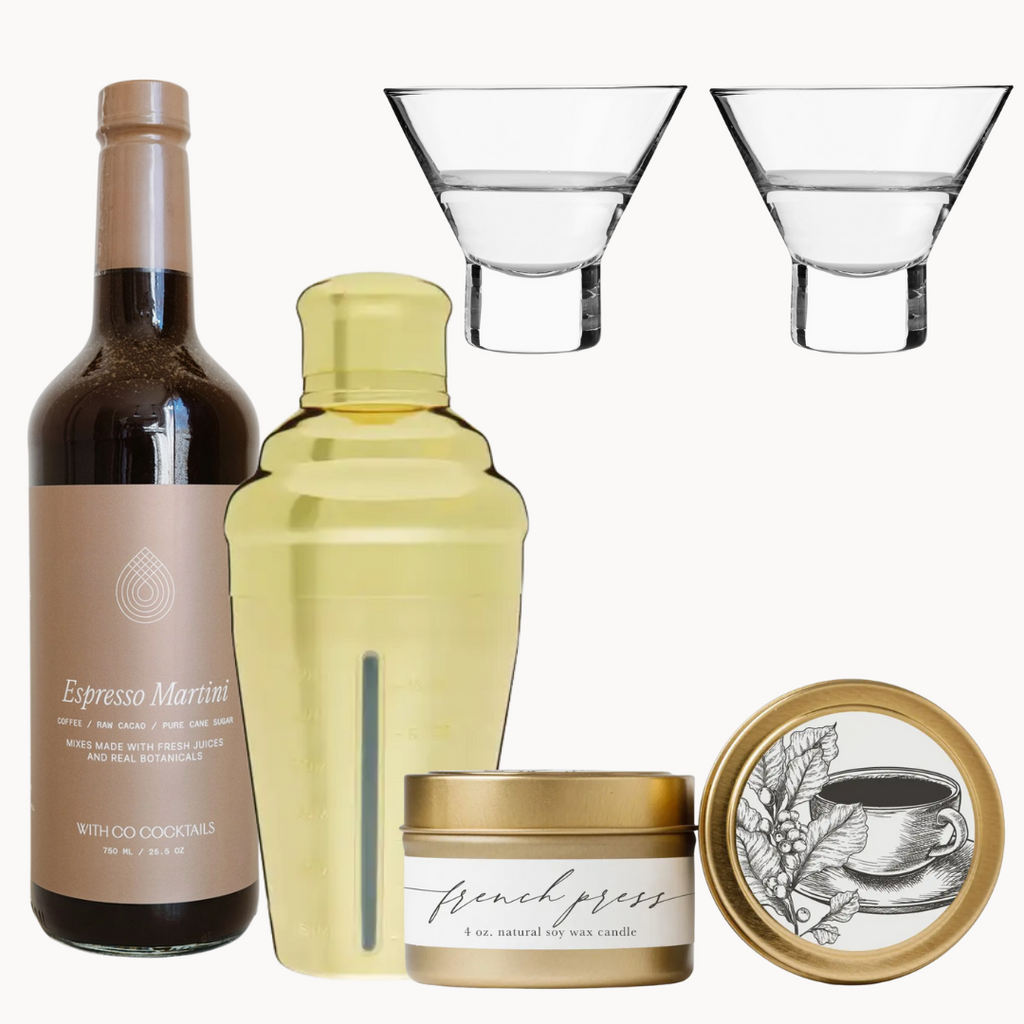 Collection of items including a bottle, shaker, candle, and glasses on a white background