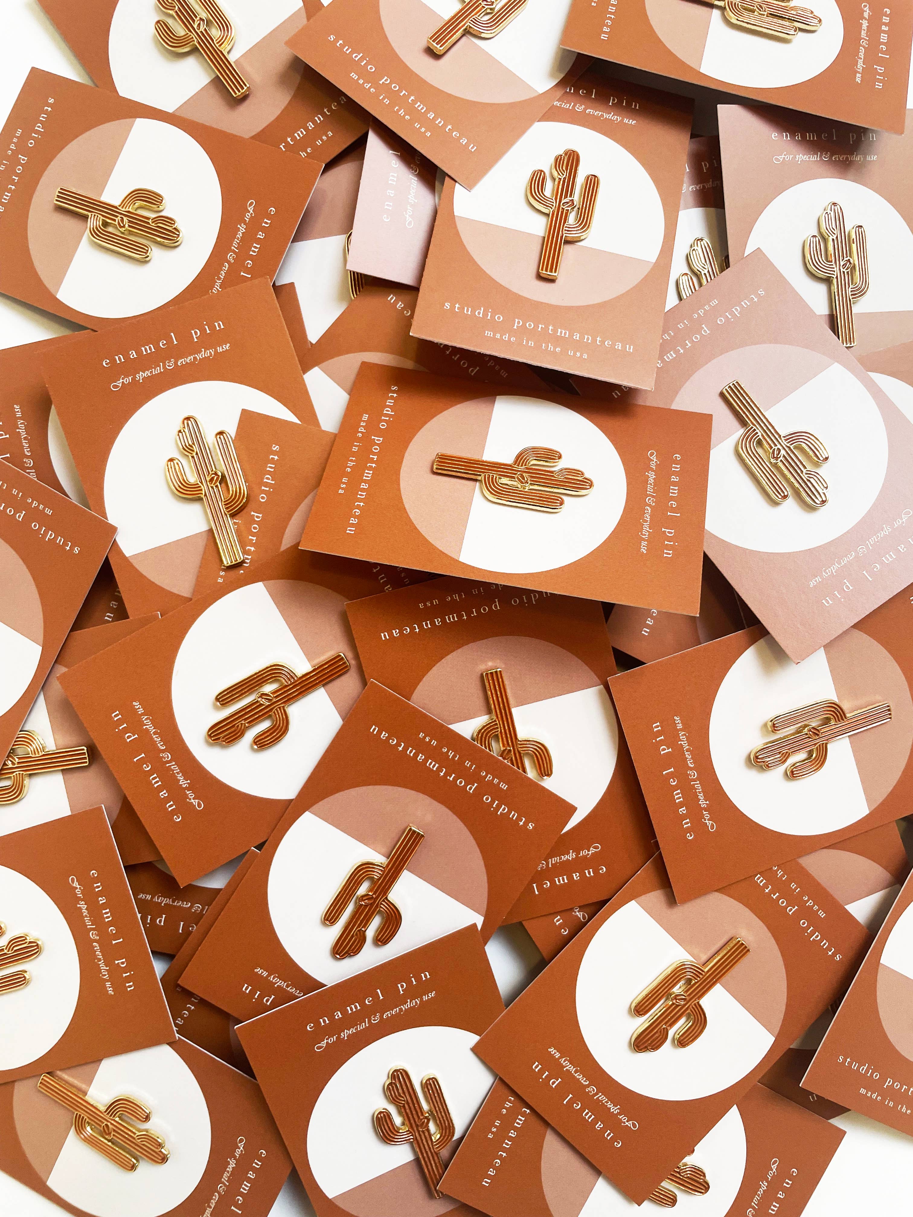 many cactus pins in packaging