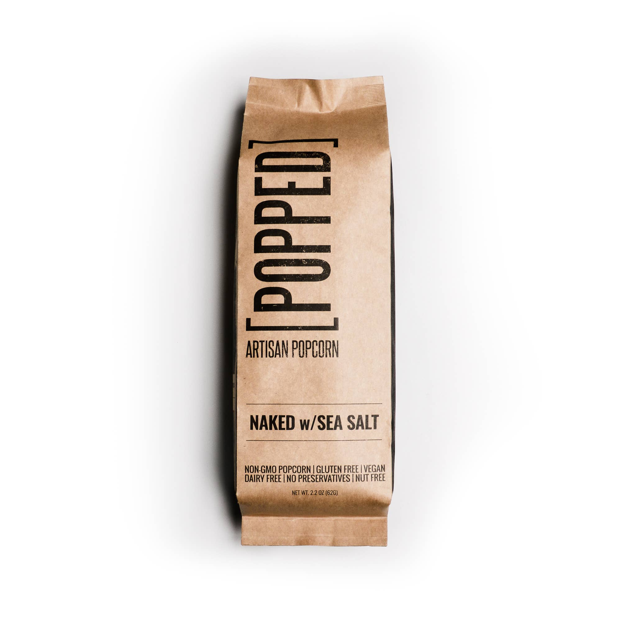 Kraft paper bag of 'Popped' artisan popcorn with 'Naked w/Sea Salt' text on a white background