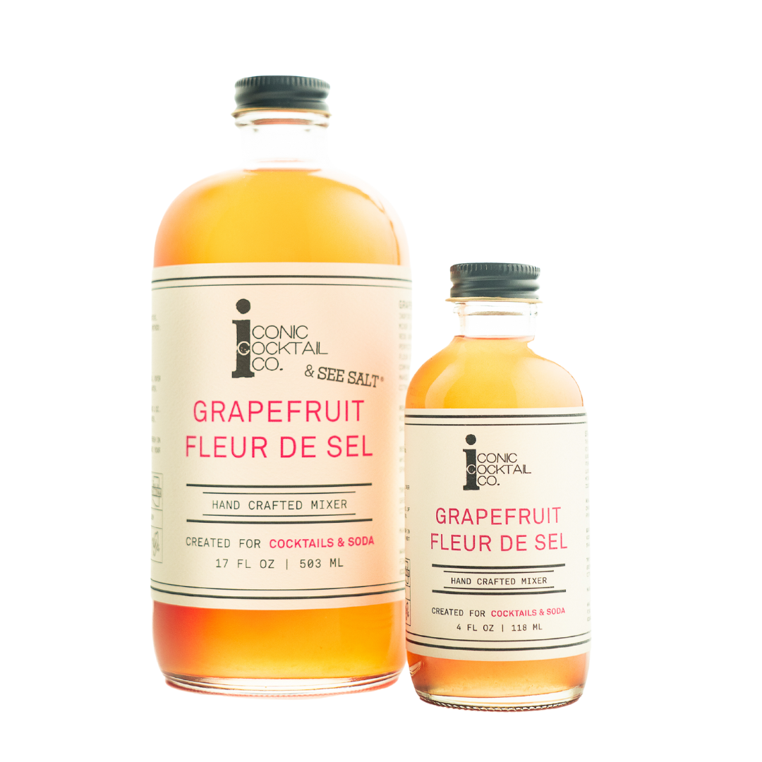 Two bottles of Grapefruit Fleur de Sel mixer from Iconic Cocktail Co. on a white background.