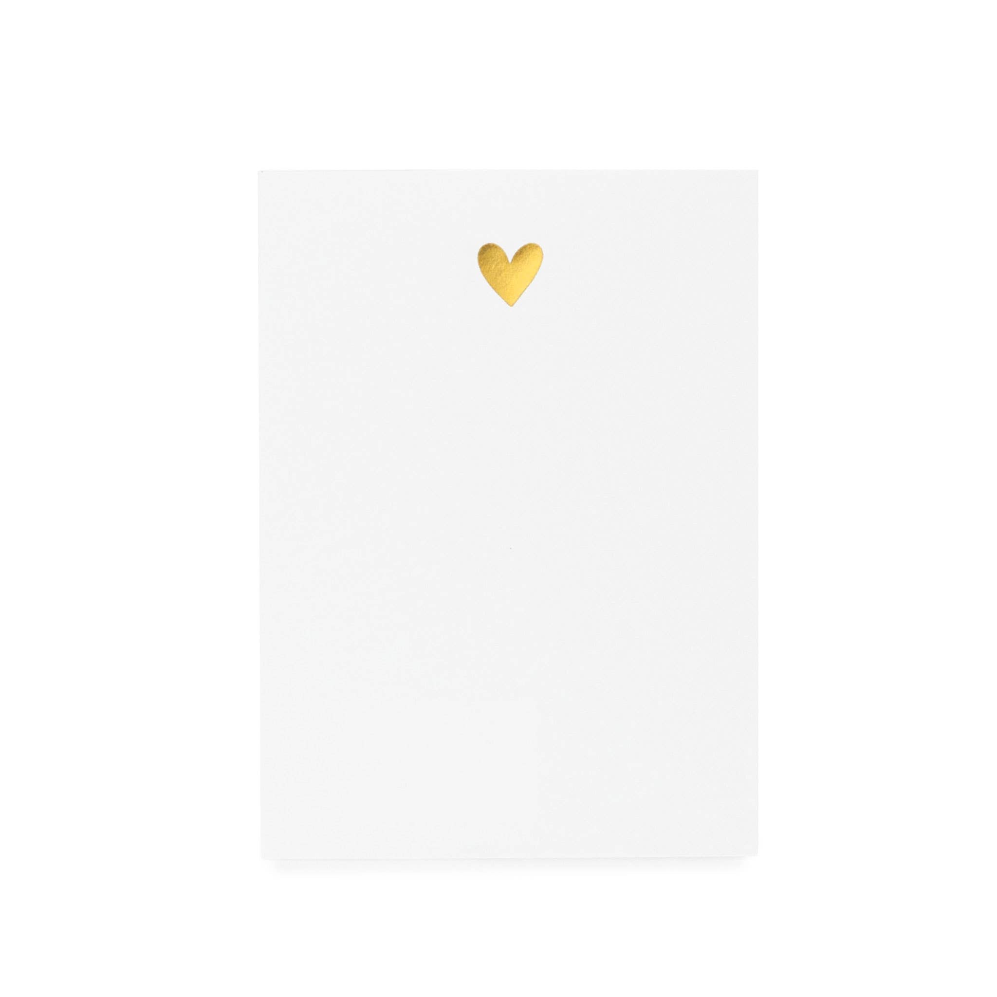 Blank white notepad with a gold heart in the center.